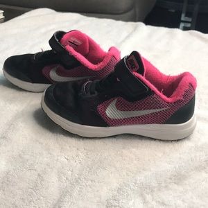Girls pink and black nike revolution 3 shoes